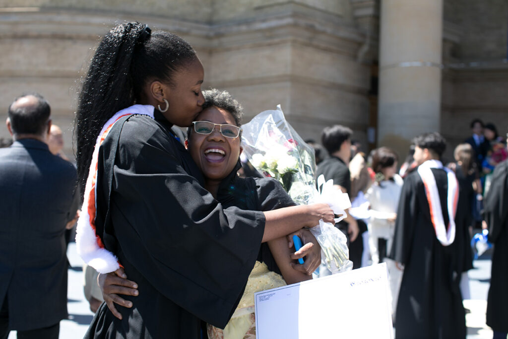 Graduating student embracing their mother at Convocation