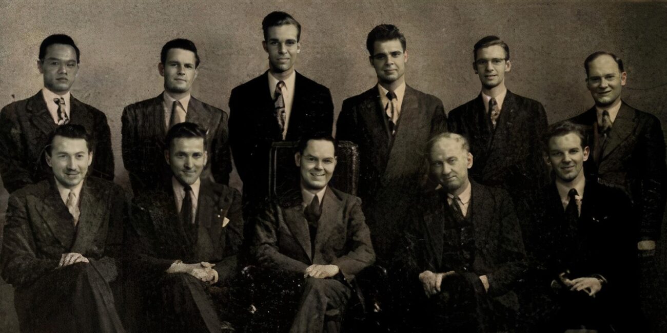 Black and white photo of a group of men wearing suits.