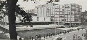 Black and white photo of concrete building.